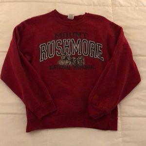 Burgundy Mt. Rushmore sweater.